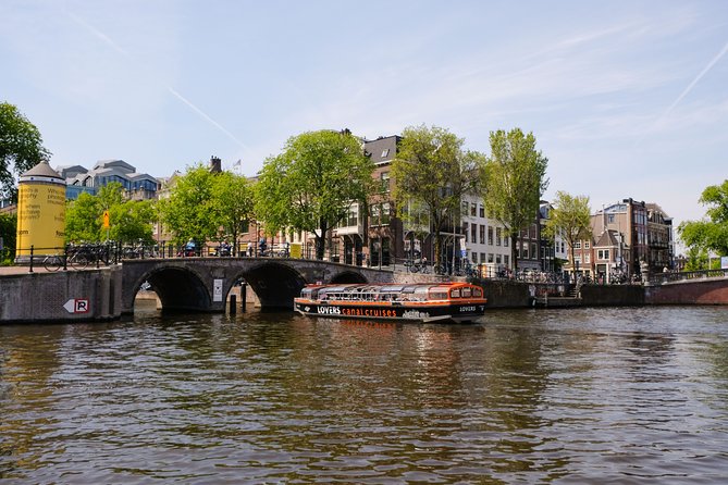 Amsterdam 1h Canal Cruise by Semi-Open Boat with Audio Guide - Red Light District, Magere Brug, and the City’s Most Photogenic Stops