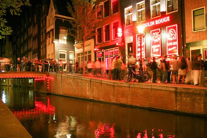 Amsterdam After Dark: Public Red Light District Exploration - Peepshow street: learning what’s behind the red-lit windows