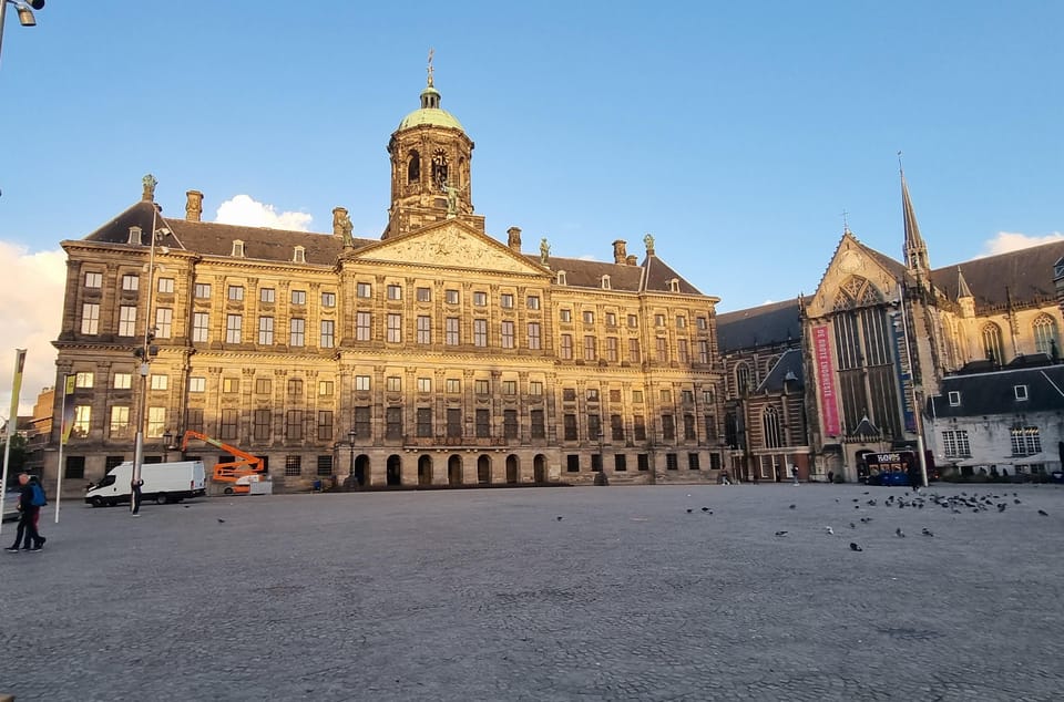 Amsterdam All In One Tour Walking Tour - Logistics that matter: distance, pace, weather, and the white umbrella meeting point
