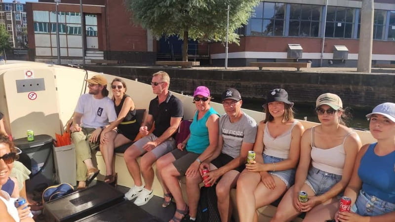 Amsterdam bike tour with a French-speaking guide local! - Dam Square: history + modern city energy at cycling speed