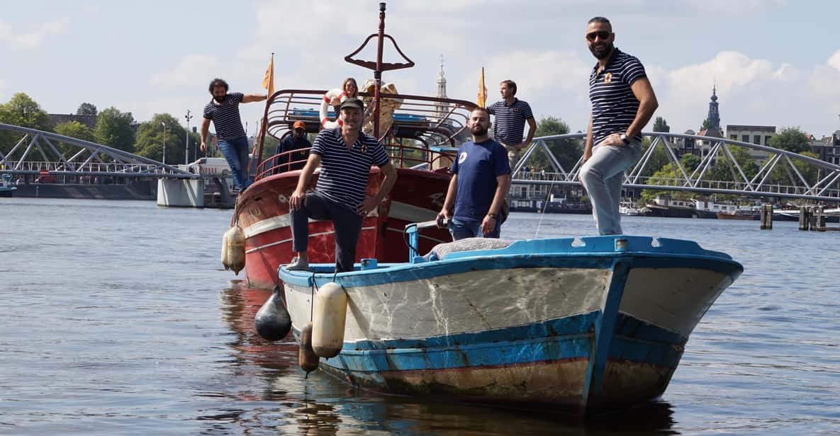 Amsterdam: Canal Cruise on a Wooden Refugee Boat - From Mediamatic Pier to a Mediterranean Refugee Boat