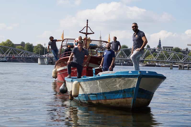 Amsterdam: Canal Cruise on a Wooden Refugee Boat - The 90-Minute Route: Canals, the Amstel, and What You’ll Actually See