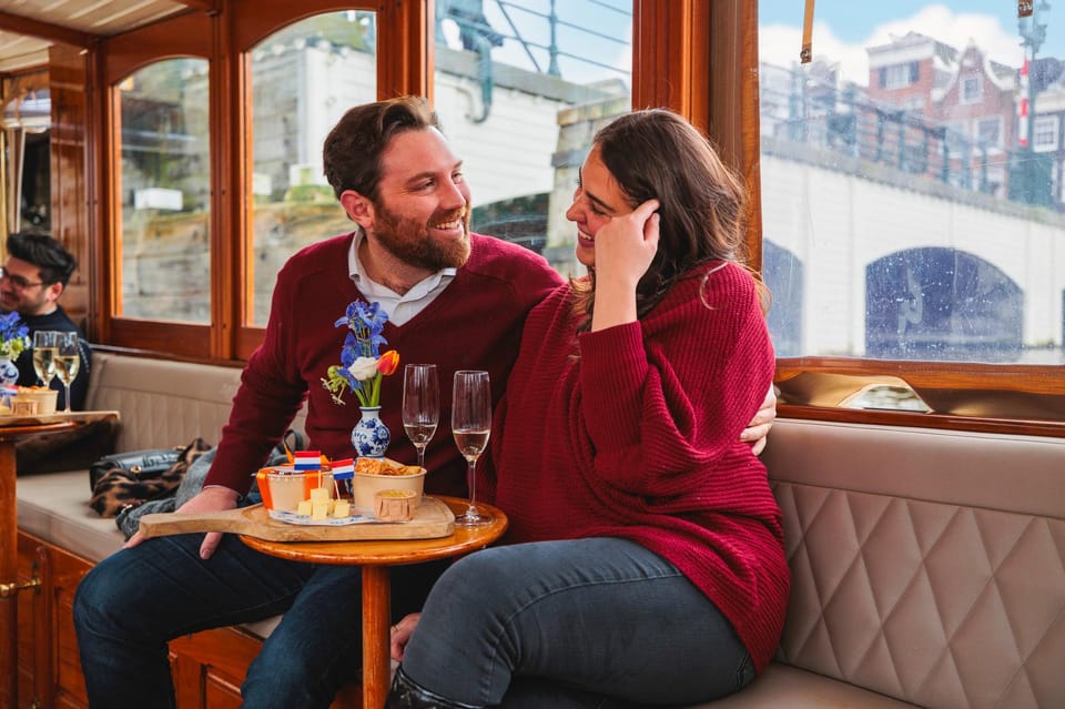 Amsterdam: Canal Cruise with Bubbles & Bites - The Skinny Bridge Moment: Romance, Photos, and the Right Kind of Goofiness