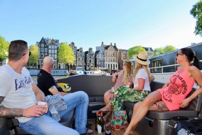 Amsterdam Canal Tour by Open Boat – 90 min Small Group Experience - The guide factor: live stories beat recorded spiels