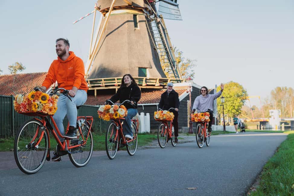 Amsterdam: Cheese, Windmill & Countryside Bike Tour - Windmill and polder scenery plus a ferry ride twist