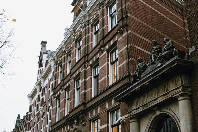 Amsterdam City Center Guided Walking Tour Semi-Private 12ppl Max - Trippenhuis, Klein Trippenhuis, and the East India Company’s courtyard power