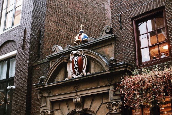 Amsterdam City Center & History - Exclusive Guided Walking Tour - Zeedijk and Nieuwmarkt: old sea walls, lock bridges, and the market square beat