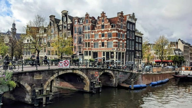 Amsterdam: City walking experience with a local - Dam Square and the Royal Palace area: Amsterdam’s public front door