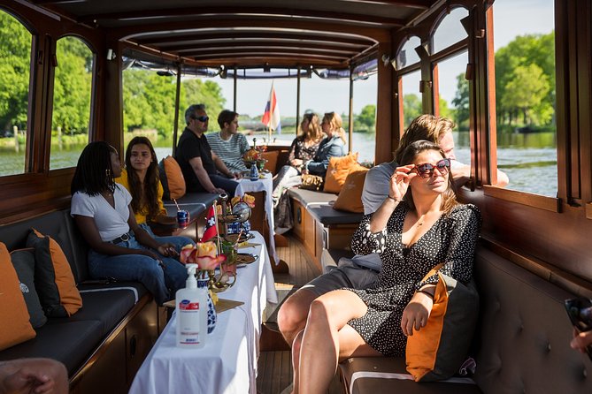 Amsterdam Classic Saloon Boat Cruise with Drinks and Cheese - Anne Frank Huis and the Surrounding Canal Stack
