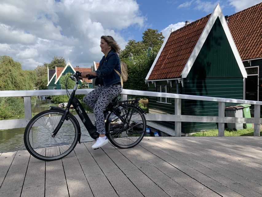 Amsterdam: Countryside Bike Tour and Zaanse Schans Windmills - Monet wetlands: biking through water scenery tied to late-1800s art