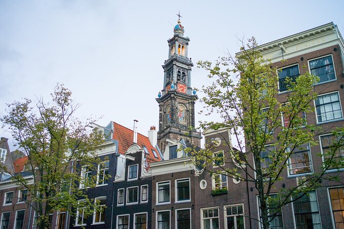 Amsterdam: Cultural Highlights in English/German/Italian - Multatuli’s statue and Magna Plaza: ideas and reuse