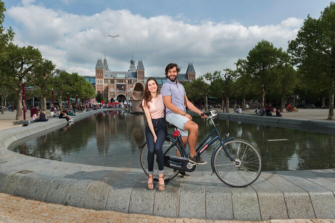 Amsterdam: E-Bike Sightseeing Tour - The Bloemenmarkt and canal-side cycling: seeing Amsterdam on purpose