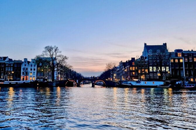 Amsterdam Evening Cruise in Small Group - Amstel River highlights: dancing houses, Munt Tower, and classic night angles
