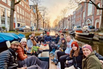 Amsterdam Evening Cruise in Small Group - Boarding comfort: blankets, roof cover, and the open-boat vibe