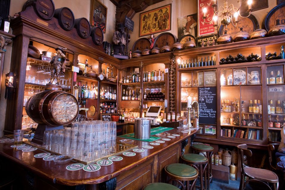 Amsterdam: Exclusive Red Light District Tour and Drink - Landmarks like the Royal Palace area, Rembrandtplein, and Grachtengordel
