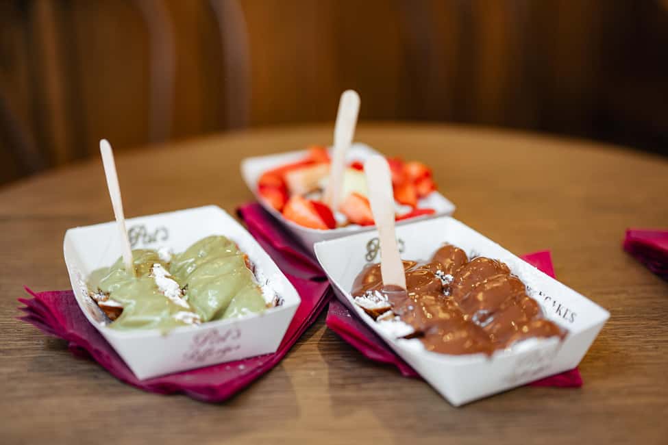 Amsterdam: Guided Cultural Food Tour in German or English - Starting at Dam Square’s National Monument: the tone of the tour