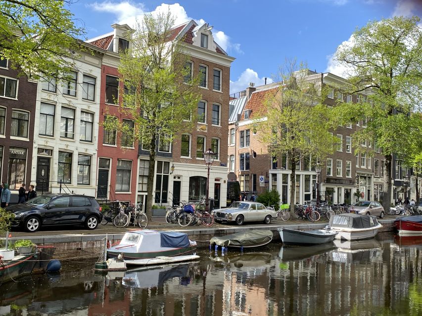 Amsterdam: Guided Off-The-Beaten-Track Walking Tour - Torensluis and the canal belt: learning the mechanics behind the famous water
