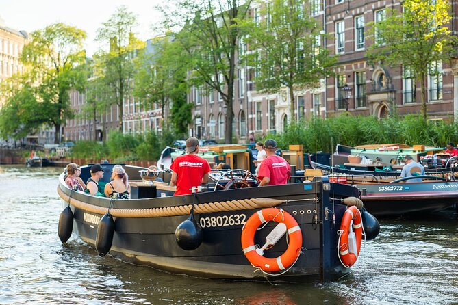 Amsterdam: Guided Open Boat Canal Cruise Unlimited Drinks Option - Science, maritime, and the shift from industry to elegance