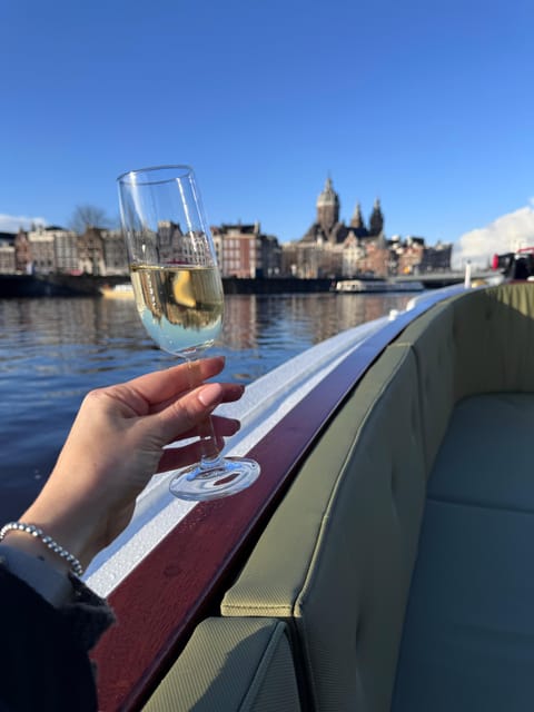 Amsterdam: Historic Boat Cruise with open bar and nibbles - Captain Bow and the human touch on the water