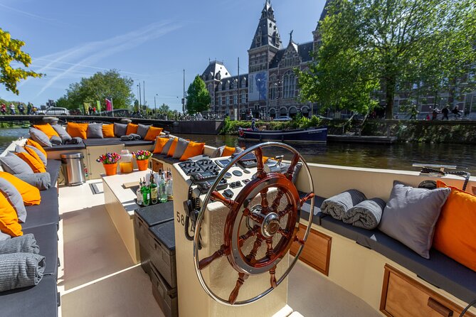 Amsterdam Light Festival: Saloon Boat Cruise + Hot Drinks & Bite - A Covered Night Cruise Through the Canal Ring