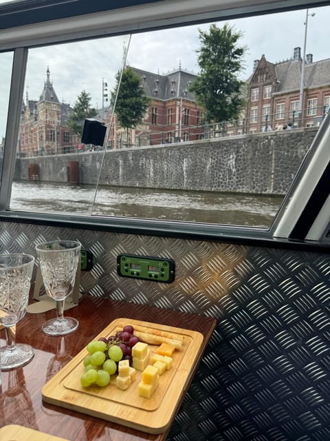 Amsterdam: Luxury Cheese & Wine Canal Cruise - What the guide actually does for your experience