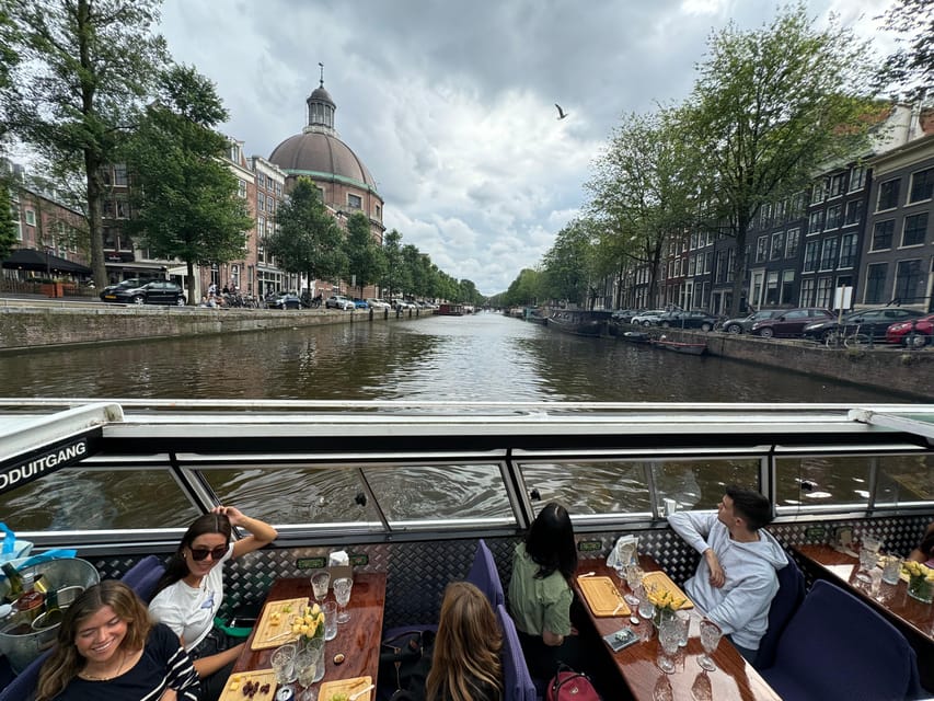 Amsterdam: Luxury Cheese & Wine Canal Cruise - Comfort reality check: open boat weather and timing hiccups