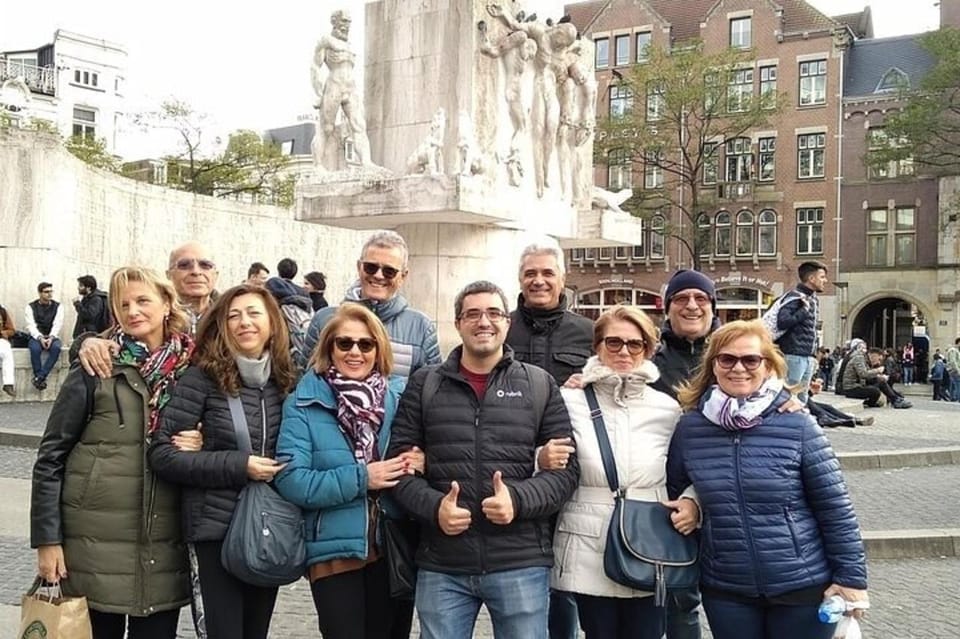 Amsterdam: Must-See Attractions Guided Walking Tour - Dam Square and the Royal Palace: power, trade, and big-city symbolism