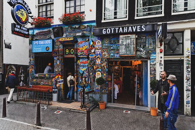 Amsterdam Must-See Historical City Walk with Local Expert - Damrak and Beursplein: architecture, old traces, and the public square mindset