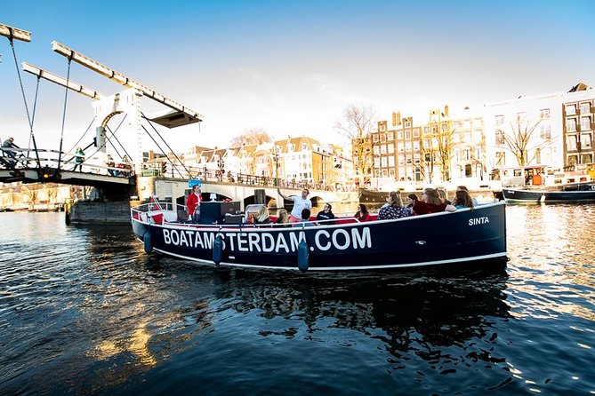 Amsterdam Open Boat Cruise with Live Guide and Two Drinks - Small-group comfort: why max 35 people matters