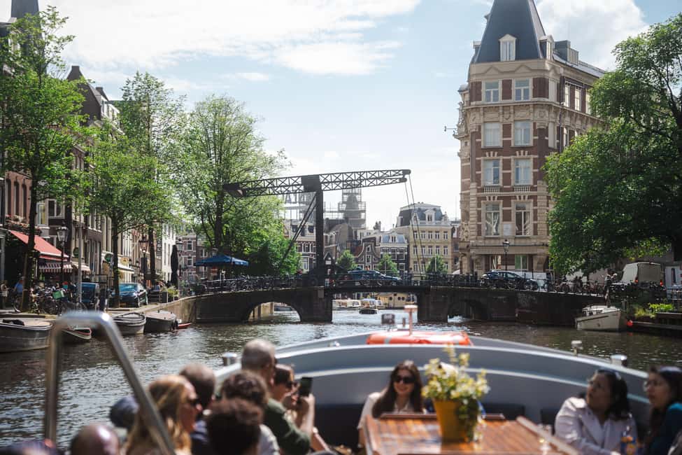 Amsterdam: Open Boat Tour of Canals with Expert Local Guide - The guide makes or breaks the ride: what you should expect