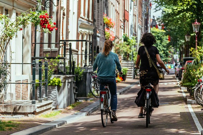 Amsterdam PRIVATE Bike Tour With Locals: Bike & Local Snack Included - Stop by stop: Westerkerk, Magere Brug, and the Gay Monument