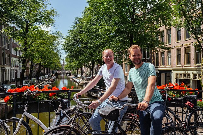 Amsterdam PRIVATE Bike Tour With Locals: Bike & Local Snack Included - Photo stops and named guides: how the guide shapes your experience