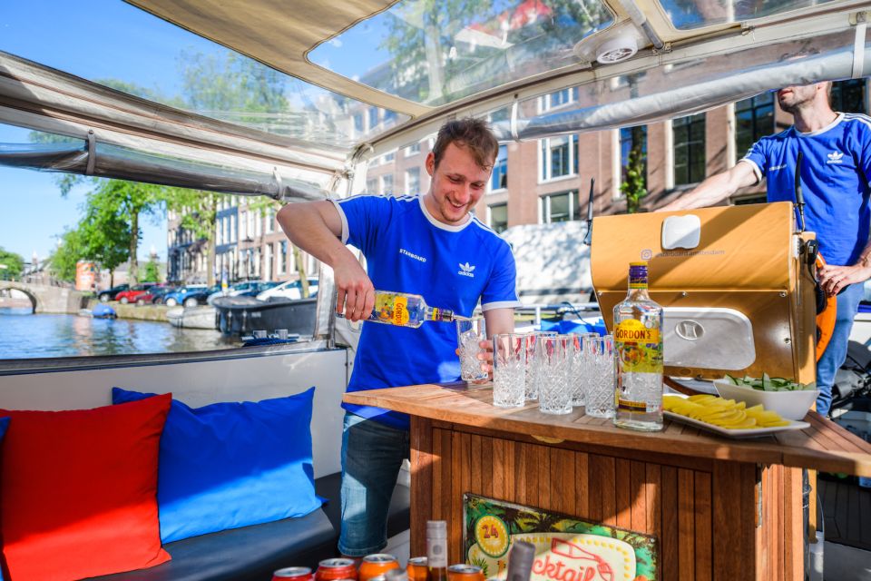 Amsterdam: Private Canal Booze Cruise with Unlimited Drinks - Your One-Hour Route: From the Red Light District Angle to Seven Bridges