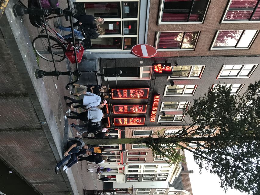 Amsterdam: Private Red Light District and Food Tour - Warmoesstraat and Nieuwmarkt Square: City Flow You Feel in Your Feet