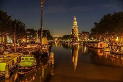 Amsterdam: Private Romantic Evening Canal Cruise + Bubbles/Snacks - Your romantic setup: Prosecco, Dutch snacks, and warm blankets
