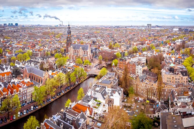 Amsterdam Red Light District Treasure: Self-Guided Tour & Quest - Montelbaanstoren: defense towers, canal-side drama, and 1517 vibes
