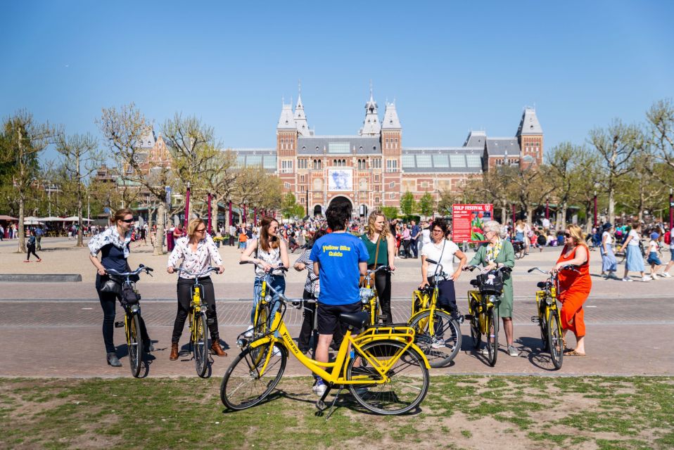 Amsterdam: Relaxed City Highlights Guided Bike Tour - The canal-girded opening: 17th-century houses and the small-house game
