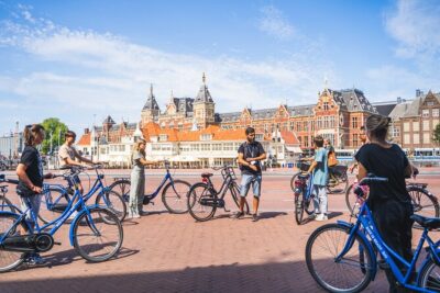 Amsterdam Small-Group Bike Tour With Optional Canal Cruise - Meeting point near the action: Nieuwezijds Voorburgwal