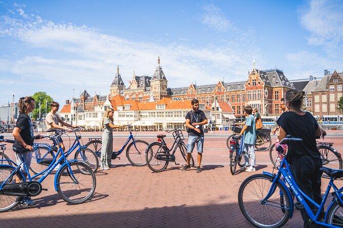Amsterdam Small-Group Bike Tour With Optional Canal Cruise - Meeting point near the action: Nieuwezijds Voorburgwal