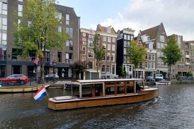 Amsterdam small-group canal cruise in 1920s saloon boat - Comfort check: heater, blankets, covered seating, and onboard drinks