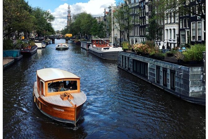 Amsterdam small-group canal cruise in 1920s saloon boat - Small group magic: how max 12 changes the vibe