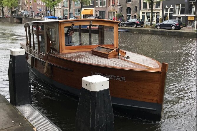 Amsterdam small-group canal cruise in 1920s saloon boat - Weather reality: what to do when Amsterdam does Amsterdam