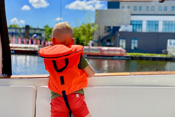 Amsterdam Small-Group Canal Cruise Including Snacks and Drinks - Weather, comfort, and what to wear on an open sloop