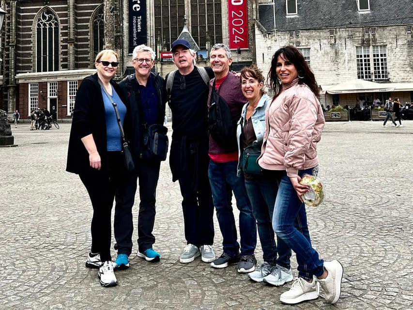 Amsterdam: Small Group Walking Tour with Fun Guide - Hidden gardens and brown cafés: the city’s softer side