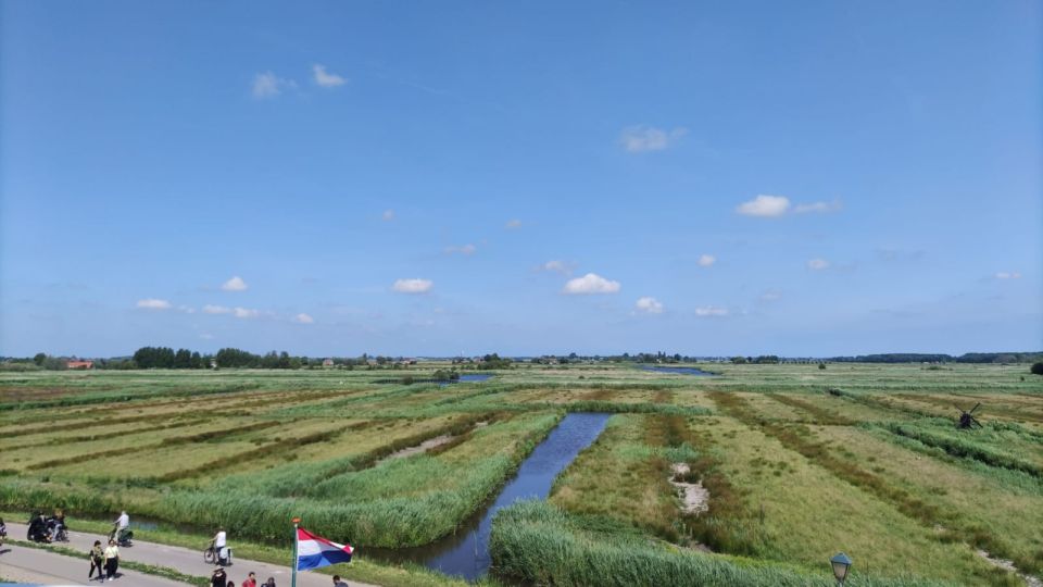 Amsterdam: Zaanse Schans Windmills Bike Tour with Guide - Paintmill De Kat: the stop that makes the windmill story click