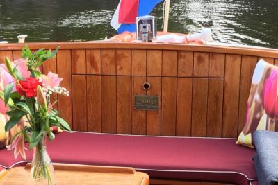 Cruise Amsterdam like a Local — Small Group 12 pax - The boat setup: heated comfort, sliding windows, and photo-friendly speed