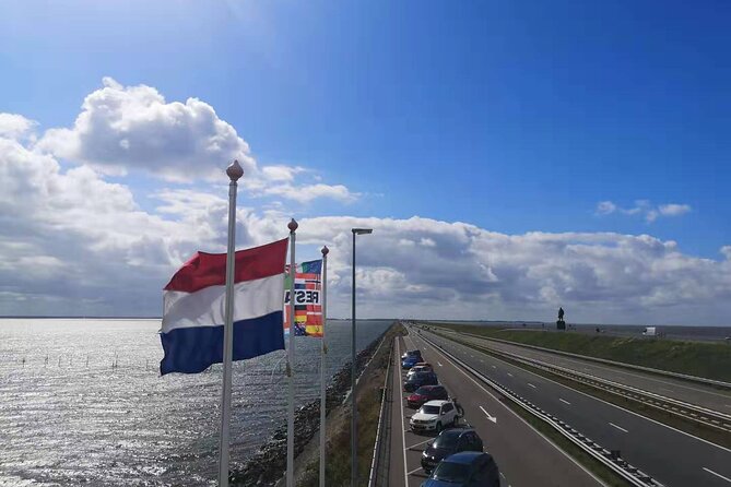 Day Tour Giethoorn, Afsluitdijk and Zaanse Schans with Boat Cruise - Zaanse Schans: cheese, wooden shoes, and diamonds in one windmill museum zone