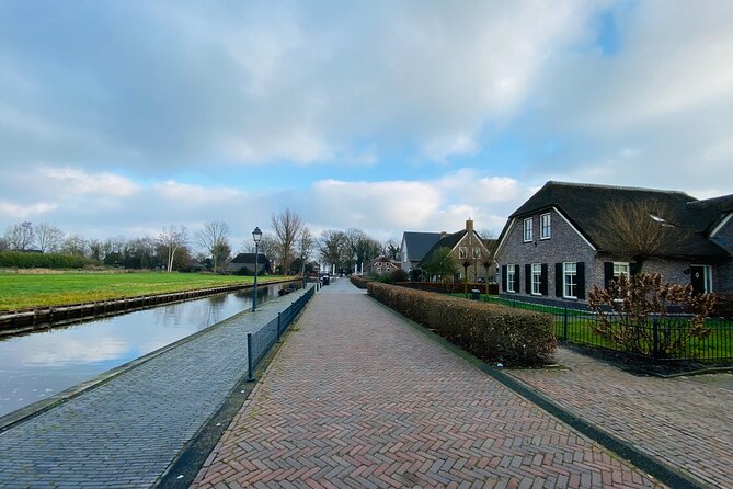 Day Tour Giethoorn, Afsluitdijk and Zaanse Schans with Boat Cruise - Afsluitdijk photo stop: big engineering views, limited by renovation