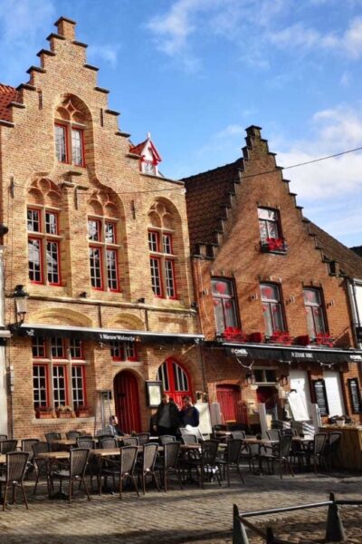 From Amsterdam: Bruges Day Trip in English with Boat Option - Pickup at ALOHA Bowling and what happens on the way out