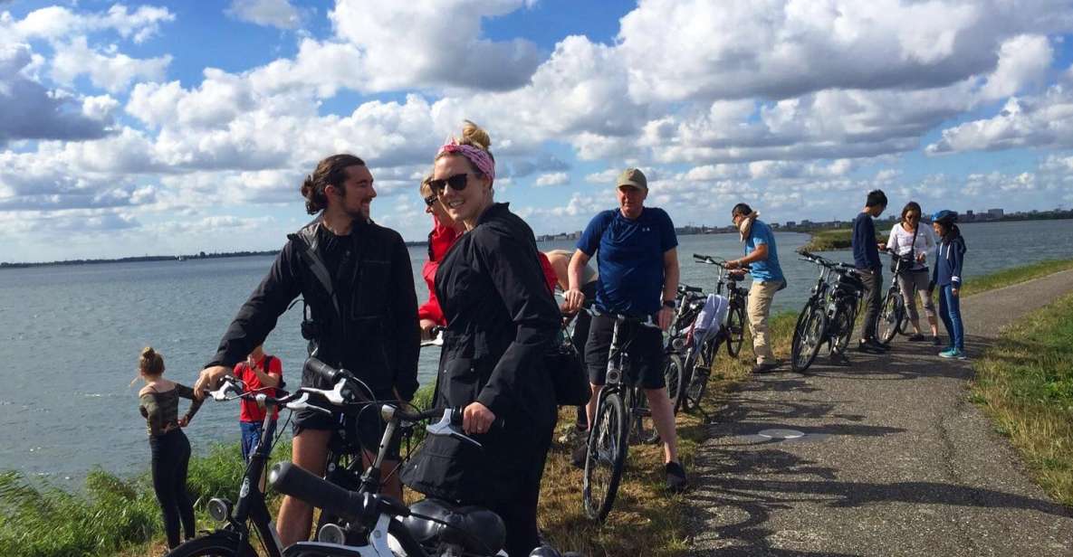 From Amsterdam: Countryside Bike Tour - From central Amsterdam to the IJ-lake ferry: the ride starts with a scene change